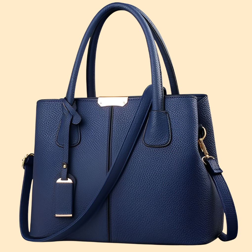 Bolso de mano estructurado con detalle de flecos