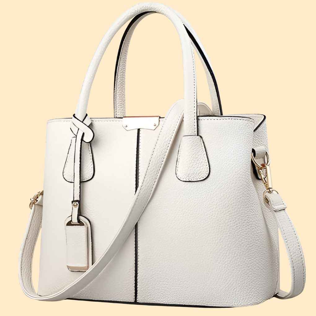 Bolso de mano estructurado con detalle de flecos