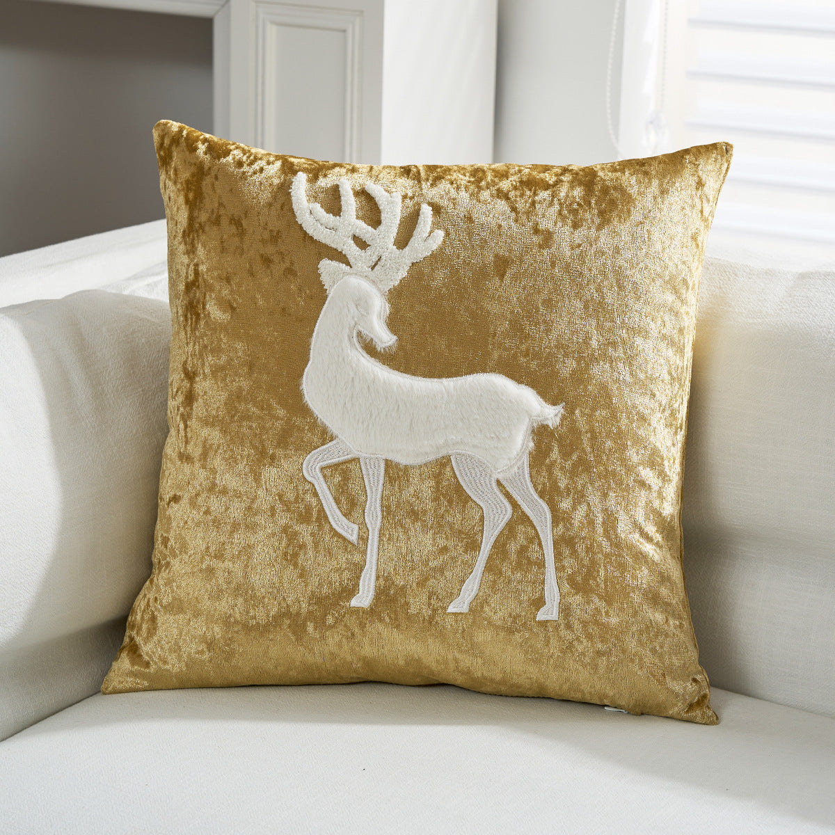 Cojín decorativo de terciopelo con motivo de reno aplicado