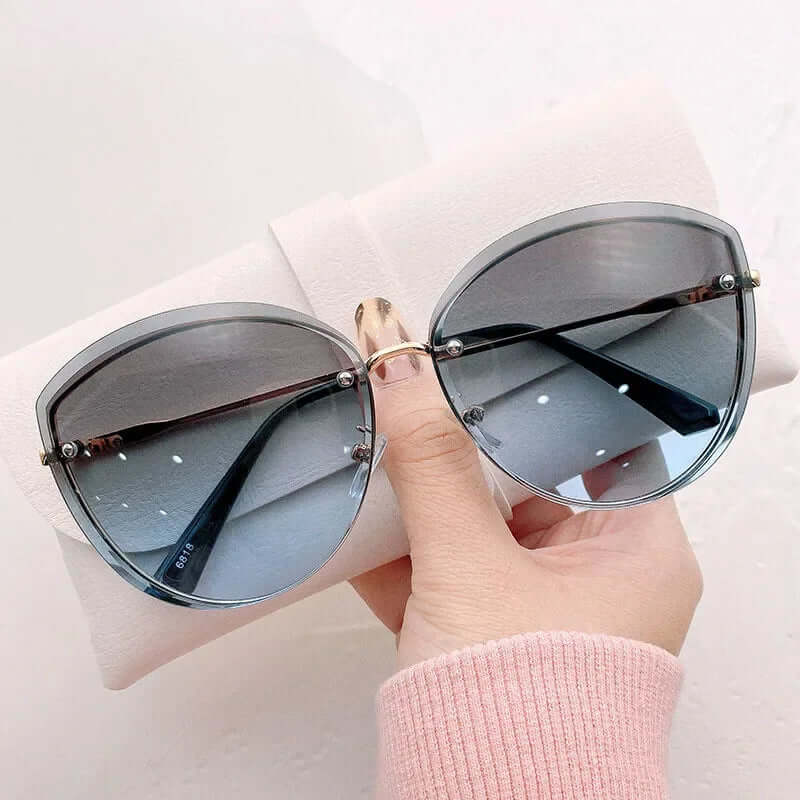 Gafas de sol para mujer sin montura con forma de ojo de gato UV400