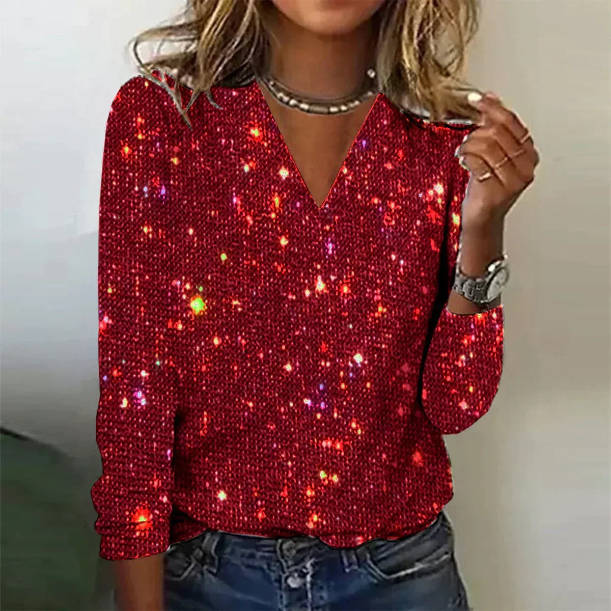 Jersey brillante con cuello en V y lentejuelas