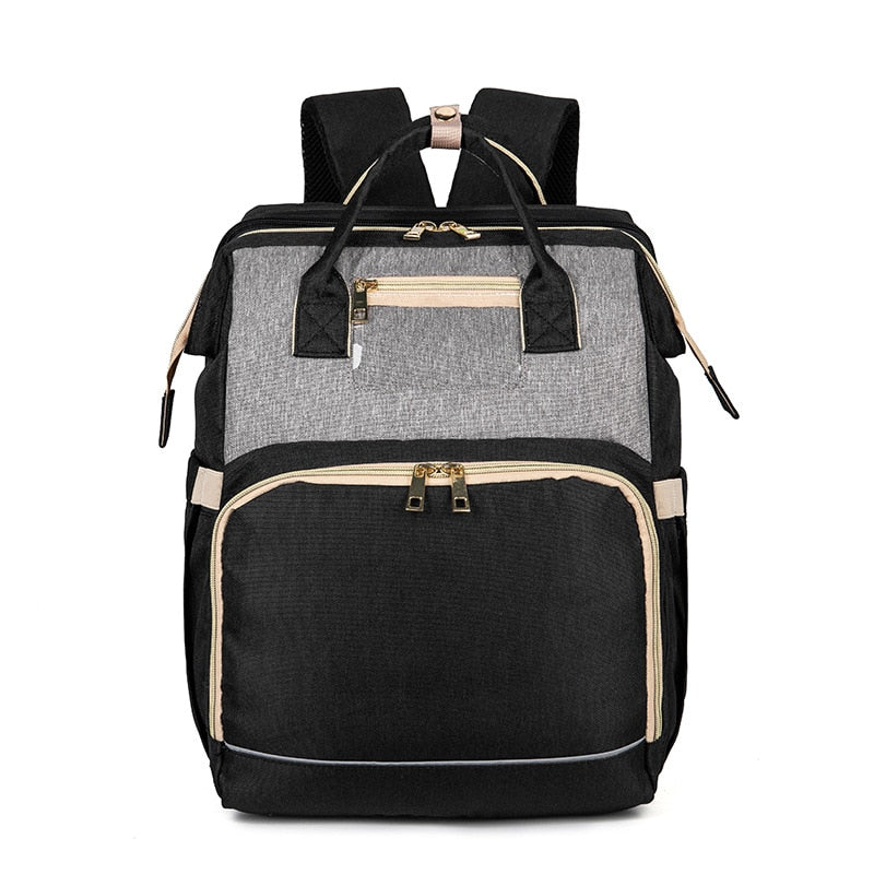 Mochila pañalera con cuna plegable – diseño impermeable con múltiples bolsillos