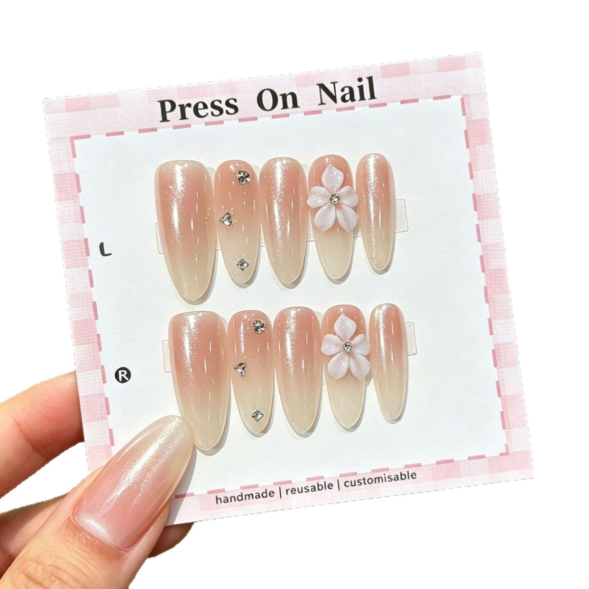 Set de uñas postizas press-on hechas a mano con detalles florales y purpurina