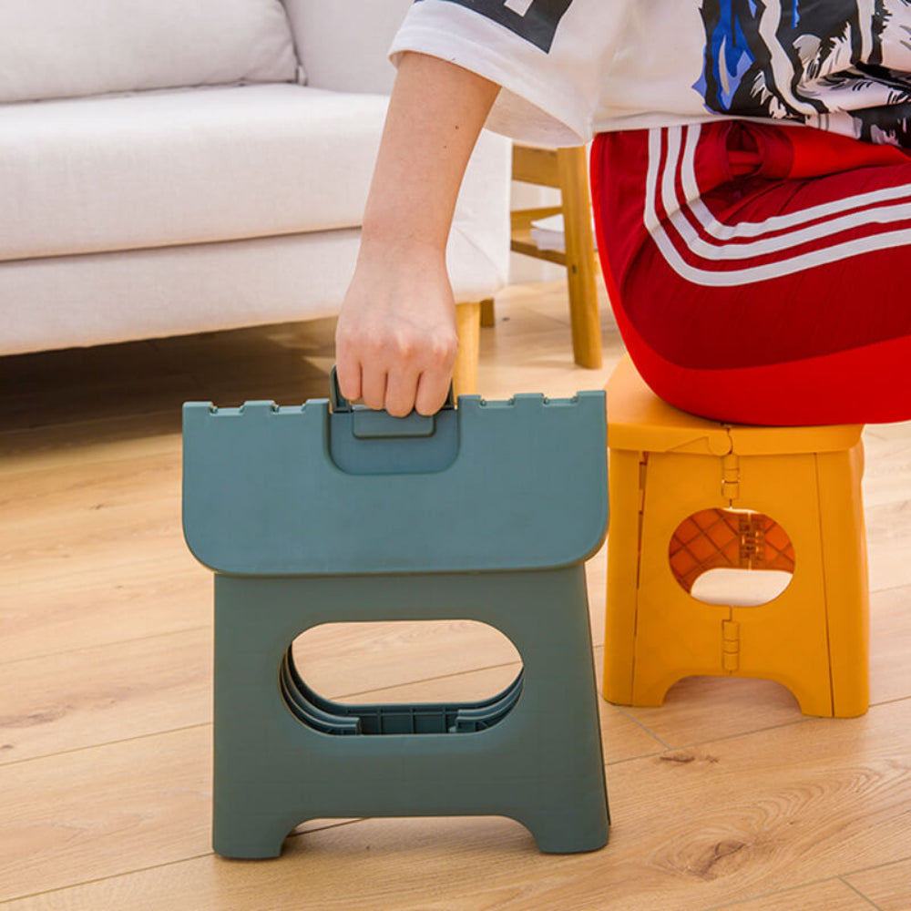 Taburete plegable portátil con asa de transporte