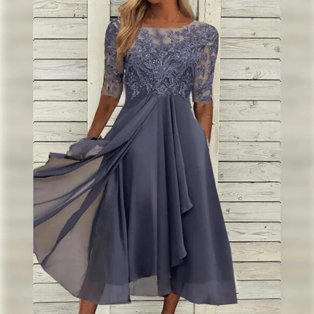 Vestido midi elegante con detalle de encaje y falda fluida para ocasiones especiales